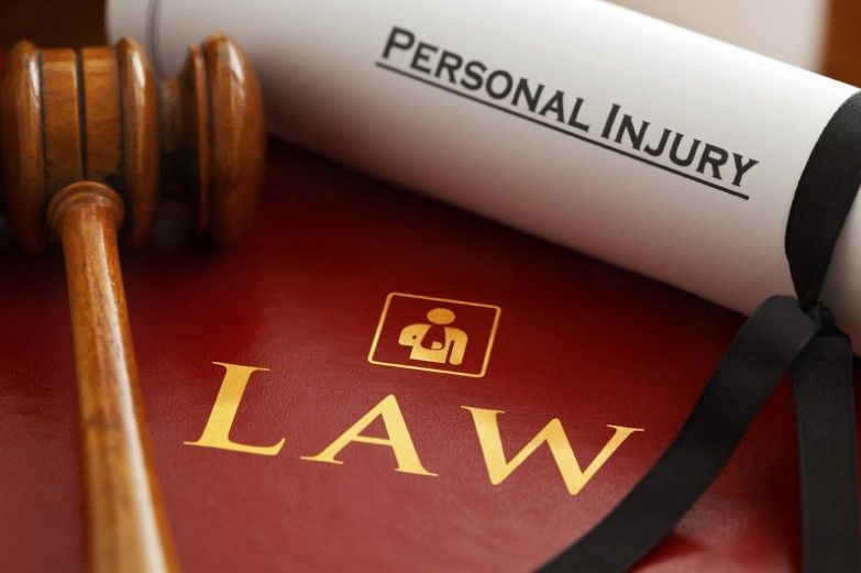 personal injury claim files and a gavel